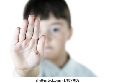 A Child Making S Stop Gesture With His Hand