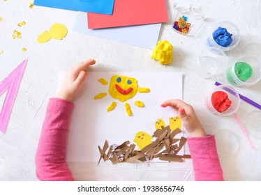 Child Making Spring Card From Colorful Paper And Clay. Handmade. Project Of Children's Creativity, Handicrafts, Crafts For Kids.