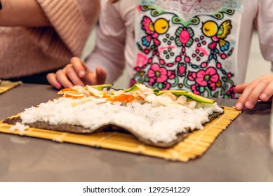 A Child Making Sushi