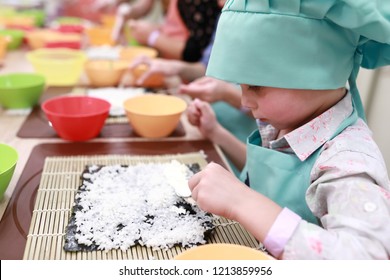 Child Is Making Sushi At Cooking Class