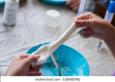 Child Making A White Slime And They Are Playing With Slime