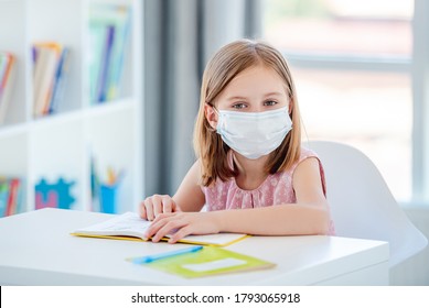 Child In Mask Studying At School