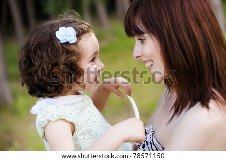 Child and mom looking and smiling each other
