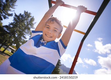 Child, monkey bars and park in portrait, smiling and energy at obstacle course on outdoor adventure. Happy male person, active and exercise on jungle gym, boy and fitness on playground in Australia
