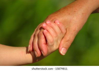 Child And Mother Holding Hands