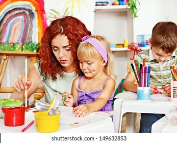 Child With Mother Painting . Child Care.
