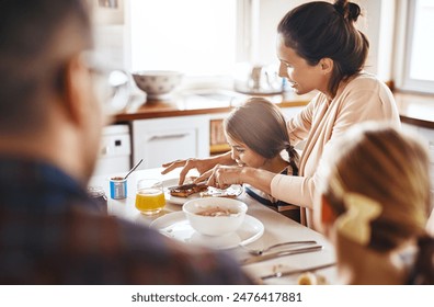 Child, mother and toast for breakfast with help, smile and family in kitchen at home. Woman, daughter and cutting bread at table for support, nutrition and healthy meal in morning with parents - Powered by Shutterstock