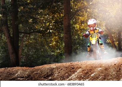 Child Motocross Bike Jump On Track.