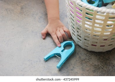 Child Motor Skills Practiced With Household Item Likes Clothes Peg, Kid Hand Reaching For A Clothespin 