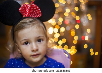 Child With Mouse Ears. Bokeh Backgroung