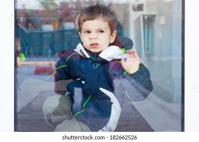 Child With Nose Against Window