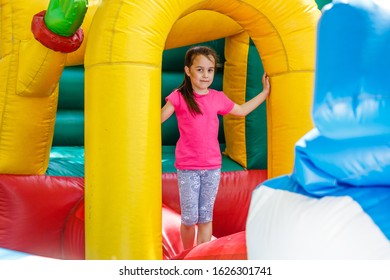child on a colorful trampoline - Shutterstock ID 1626301741