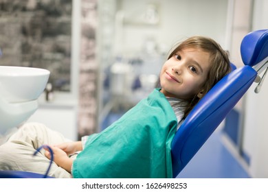 Child On Regular Dental Check Up In Clinic