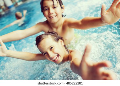 Child On Summer Swimming Pool Vacation Having Fun And Happy Life Time