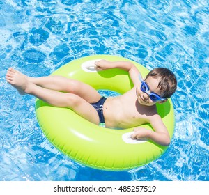 Child On Summer Swimming Pool Vacation Having Fun And Happy Life Time