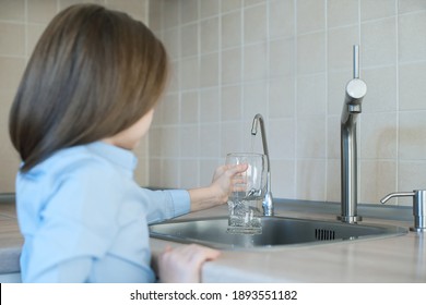 Child Open Water Tap. Kitchen Faucet. Glass Of Clean Water. Pouring Fresh Drink. Hydration. Healthy Lifestyle. Water Quality Check Concept. World Water Monitoring Day. Environmental Pollution Problem