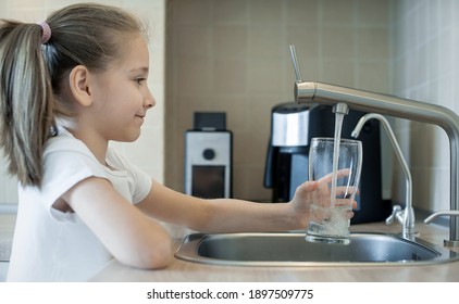 Child Open Water Tap. Kitchen Faucet. Glass Of Clean Water. Pouring Fresh Drink. Hydration. Healthy Lifestyle. Water Quality Check Concept. World Water Monitoring Day. Environmental Pollution Problem