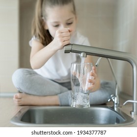 Child Open Water Tap. Kitchen Faucet. Glass Of Clean Water. Pouring Fresh Drink. Hydration. Healthy Lifestyle. Water Quality Check Concept. World Water Monitoring Day. Environmental Pollution Problem