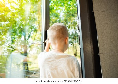 Child Opening Entrance Door, Boy Leaving House, Going Outside From The House At The Fresh Air.