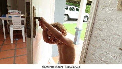 Child Opening Front Door. Adorable Cute Kid Opens Home Front Door