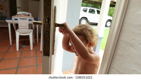 Child Opening Front Door. Adorable Cute Kid Opens Home Front Door