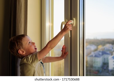 Child Opening Window Without Parents, Holding Handle. Dangerous Situation