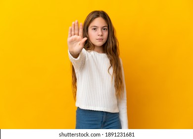 Child Over Isolated Yellow Background Making Stop Gesture