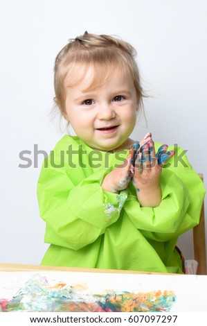 Similar – Babymädchen spielt mit Haarspangen in den Händen