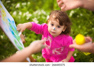 Child Painting Hands Outside