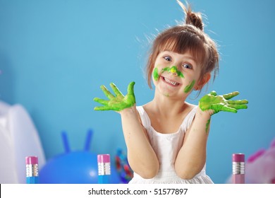 Child Painting In The Kindergarten