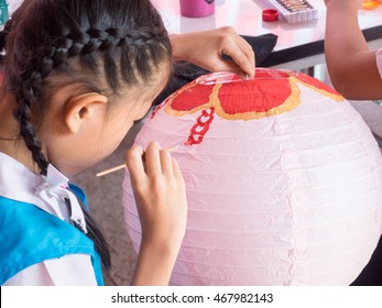 Child Painting Paper Lantern
