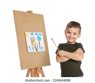 Child Painting Picture On Easel Against White Background
