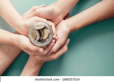 child and parent hands holding money jar, donation, saving, charity, family finance plan concept, Coronavirus economic stimulus rescue package, superannuation concept