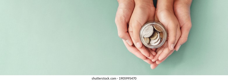 child and parent hands holding money jar, fundraising charity donation, saving, family finance plan concept