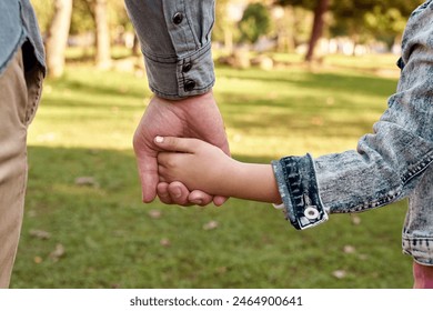 Child, parent and holding hands in nature or back, childhood development and growth with love for girl. Parenting, walking and park for relationship on vacation, people bonding and caring father - Powered by Shutterstock