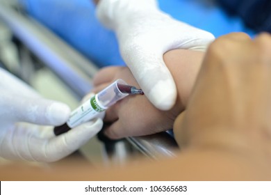 Child Patient Blood Test At Left Arm On Stretcher.