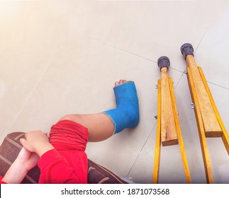 Child Patient In Splint Leg Compression Knee Brace Support Injury On The Bed In Nursing Hospital.healthcare And Medical Support.