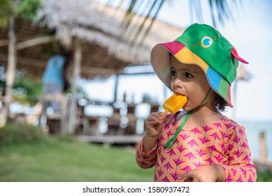 Child With Picole. Child Eating Ice Cream