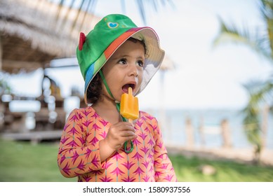 Child With Picole. Child Eating Ice Cream