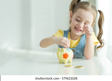 Child With Piggy Bank 