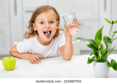 Child With A Pill Dragee On Her Tongue. Taking Medicine, Vitamin Supplements, Health Care, Treatment Concept. Full Multivitamin Formula With Minerals