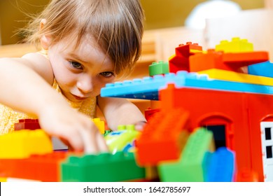 Child In Playgroup Of Kindergarten Playing