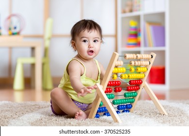 Child Playing With Abacus