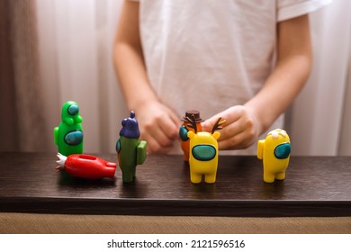 Child playing with among us toys