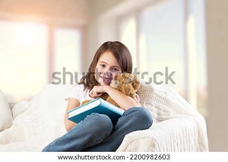 Similar – young caucasian little boy playing with tablet on couch