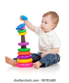 Child playing with educational cup toys. Isolated on white background