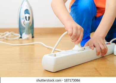 Child Playing With Electricity, Kids Safety Concept