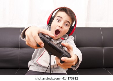 Child Playing With Game Console