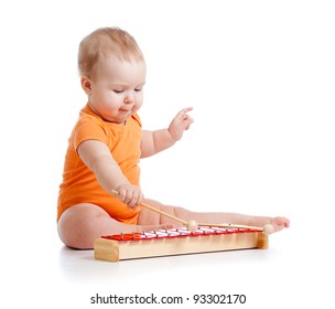 child playing with musical toy
