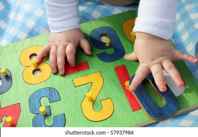 a child playing with a number puzzle